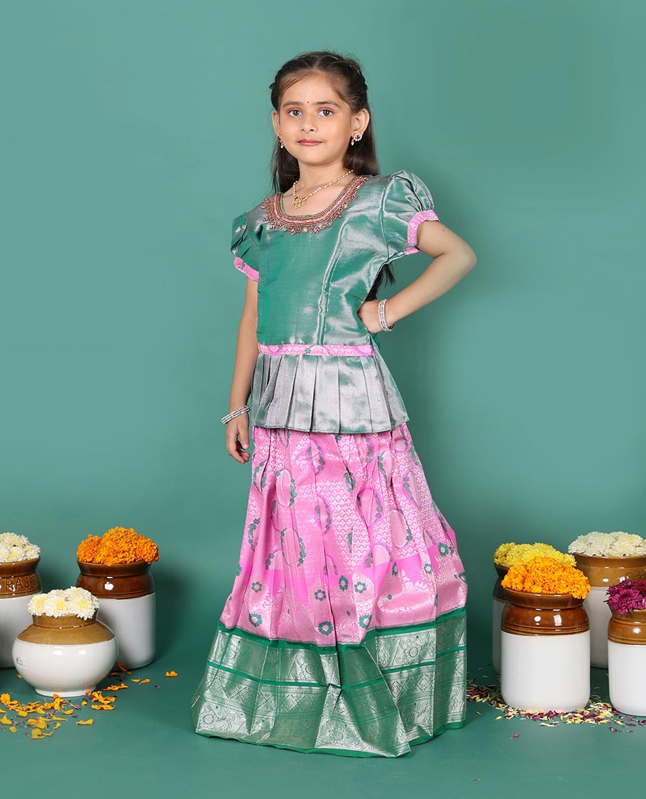 Pink art silk readymade pavadai set, jacquard with contrast traditional zari border skirt, and contrast round neck embroidered puff-sleeve blouse