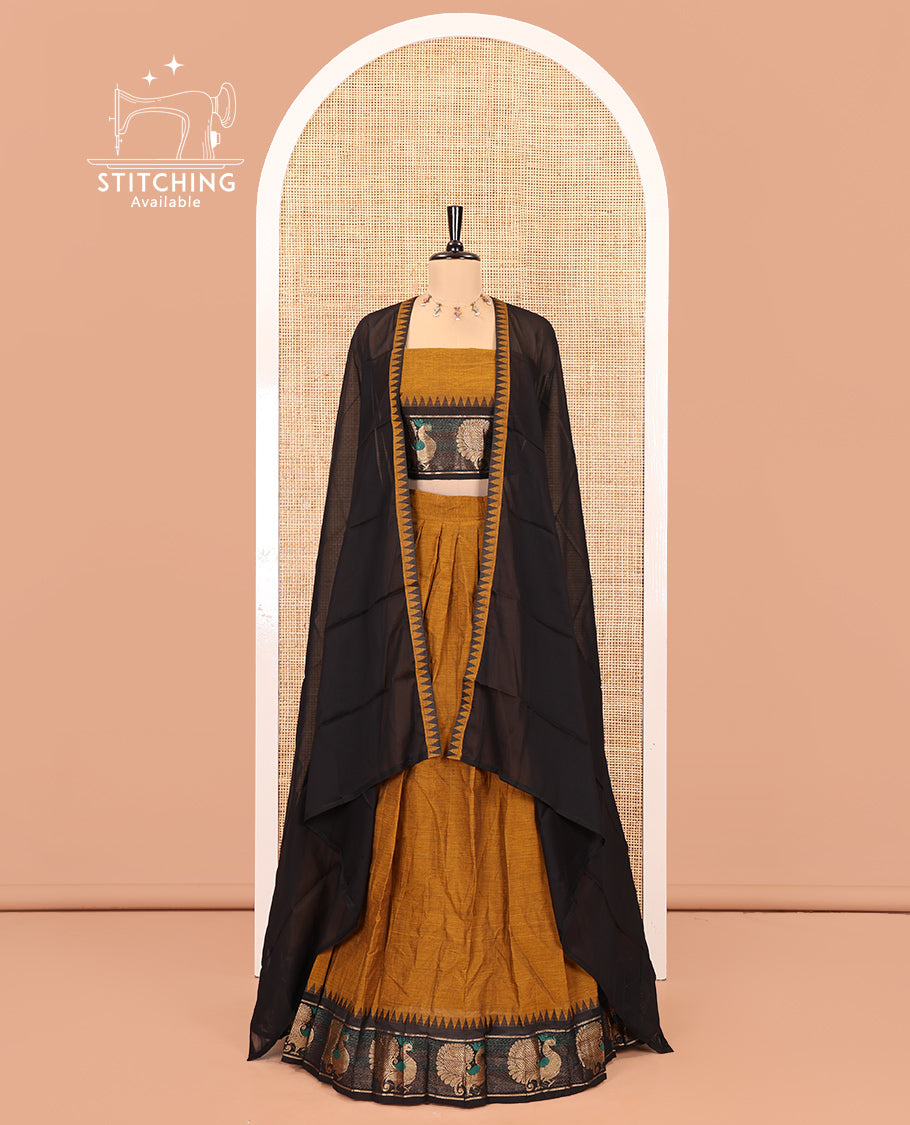 Mustard-Black Chettinad Cotton Half-Saree Set Featuring a Plain Skirt, Contrast Temple Peacock Motif Border, a Matching Blouse, and a Contrast Temple Dhavani