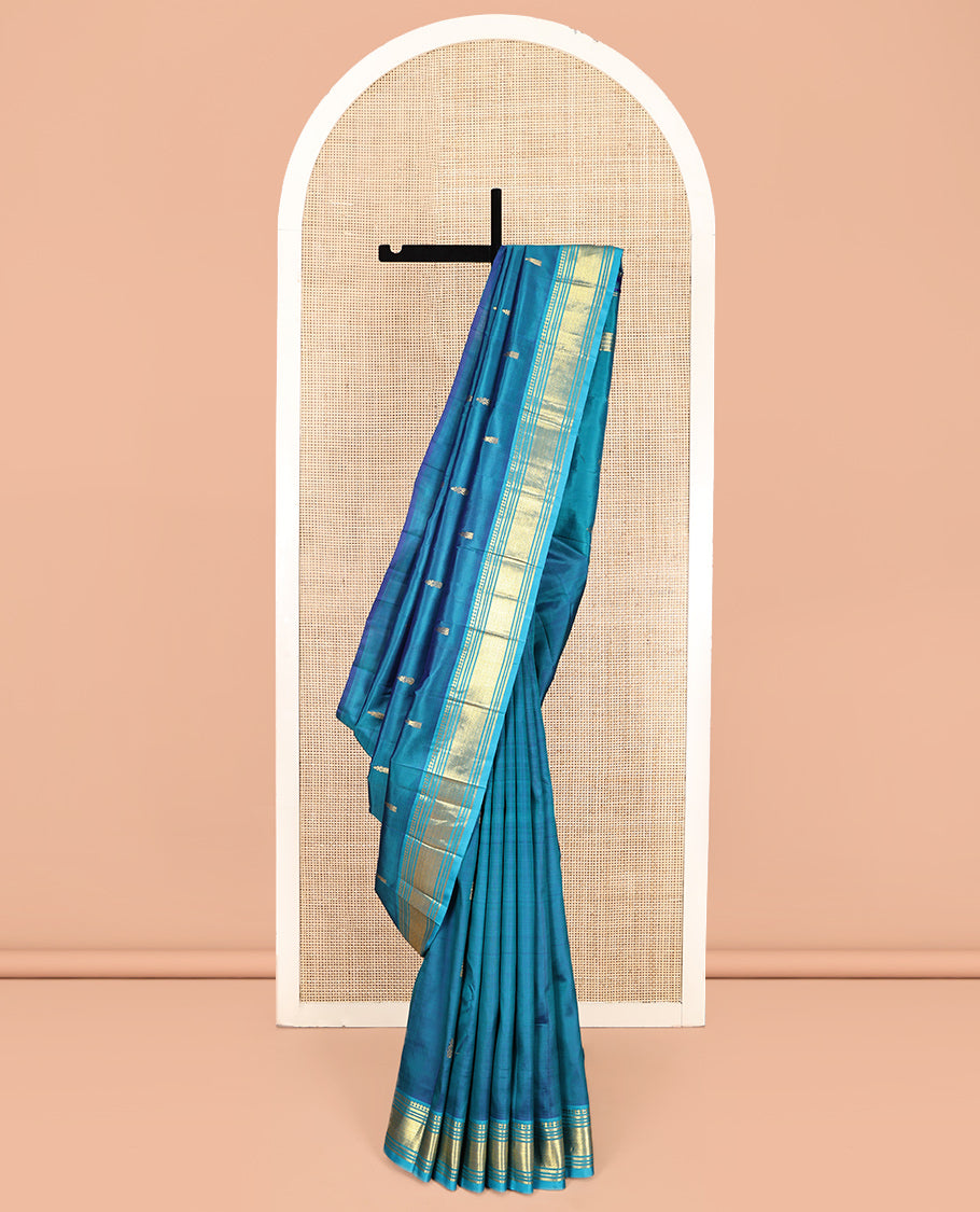 Blue Kanchipuram Silk Saree, Adorned with Zari Buttas, Complemented by a Contrast One-Sided Border of Panner Sombu, Banaras, Muthu, and Mayil Kann Designs, Grand Pallu, and No Blouse