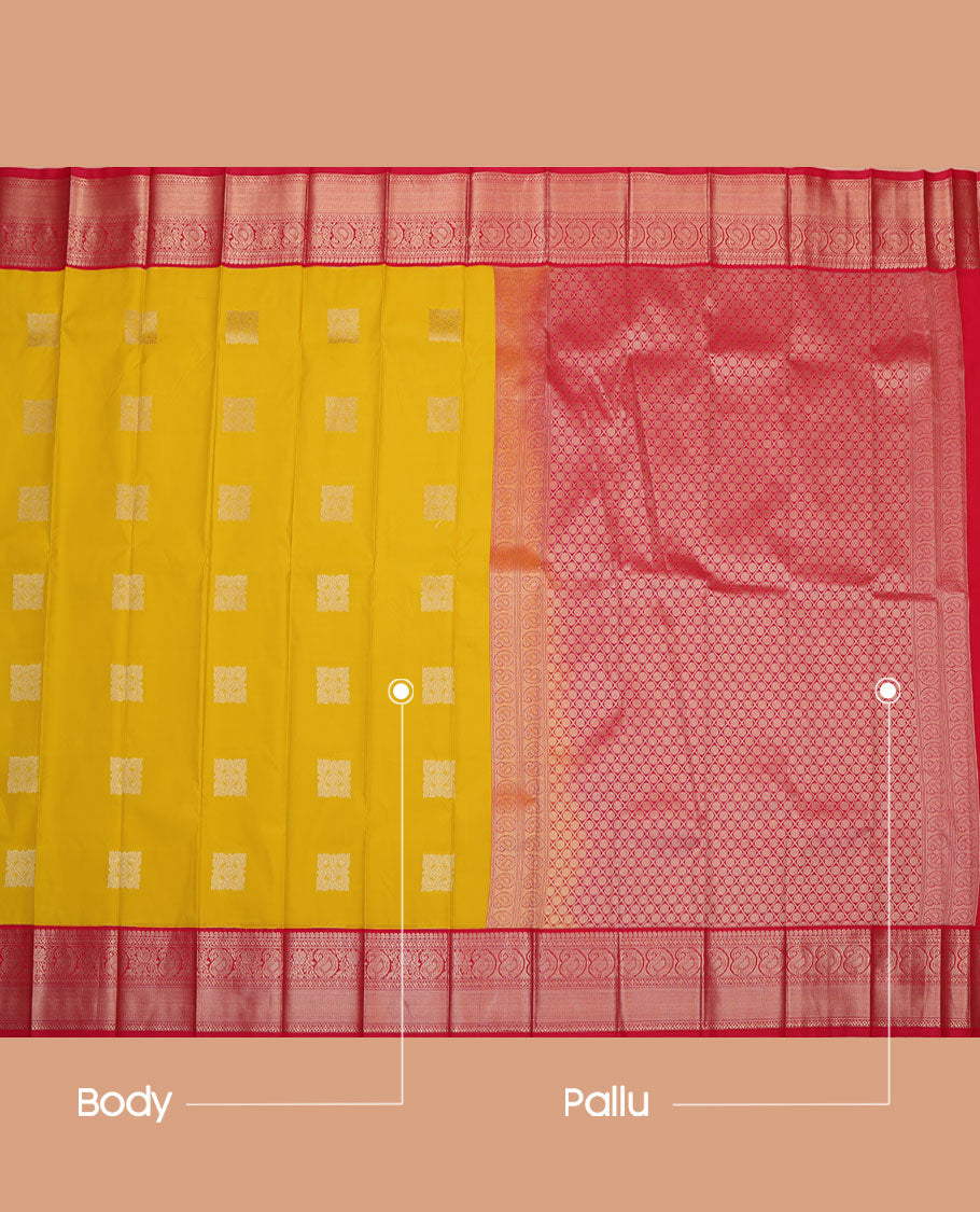 Yellow Budget Silk Saree, Sparsely Sparkled with Buttas All Over Its Body, Complemented by a Contrast Traditional Zari Border of Paisley Designs, Pallu of Rudraksham Butta Enclosed Jaal, and Paired with a Contrast Blouse