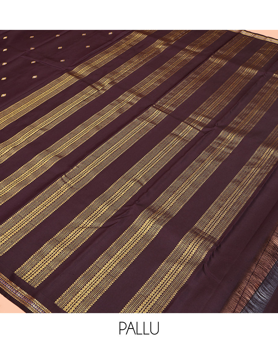 Brown Kanchipuram Silk Saree, Delicately Woven with Zari Buttas All Over Its Body, Highlighted by a Zari Border of Salngai, Muthu, and Rekku Designs, Pallu of Intricate Designs, and Paired with a Matching Blouse
