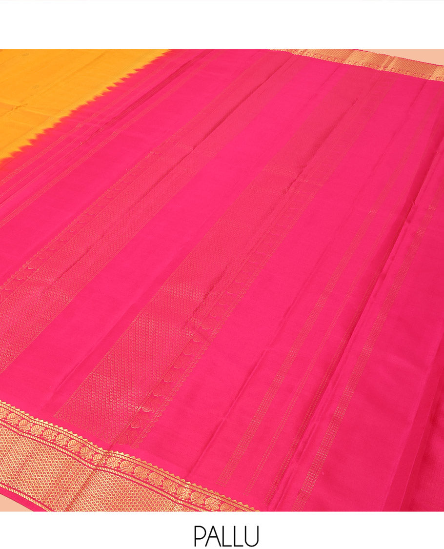 Orange Kanchipuram Silk Saree Decked Up with Zari Buttas, Complemented by Contrasting Border of Rekku, Banaras, Mayil, and Mayil Kann Designs, Pallu Mirroring the Same Border Design, and Paired with a Contrast Blouse