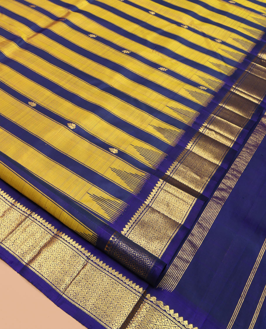Yellow Kanchipuram Silk Saree, Crafted with Zari Buttas and Stripes, Highlighted by a One-Sided Zari Border of Thilakam Mokku, and Jaal Design, Zari Design Pallu, and a No Blouse