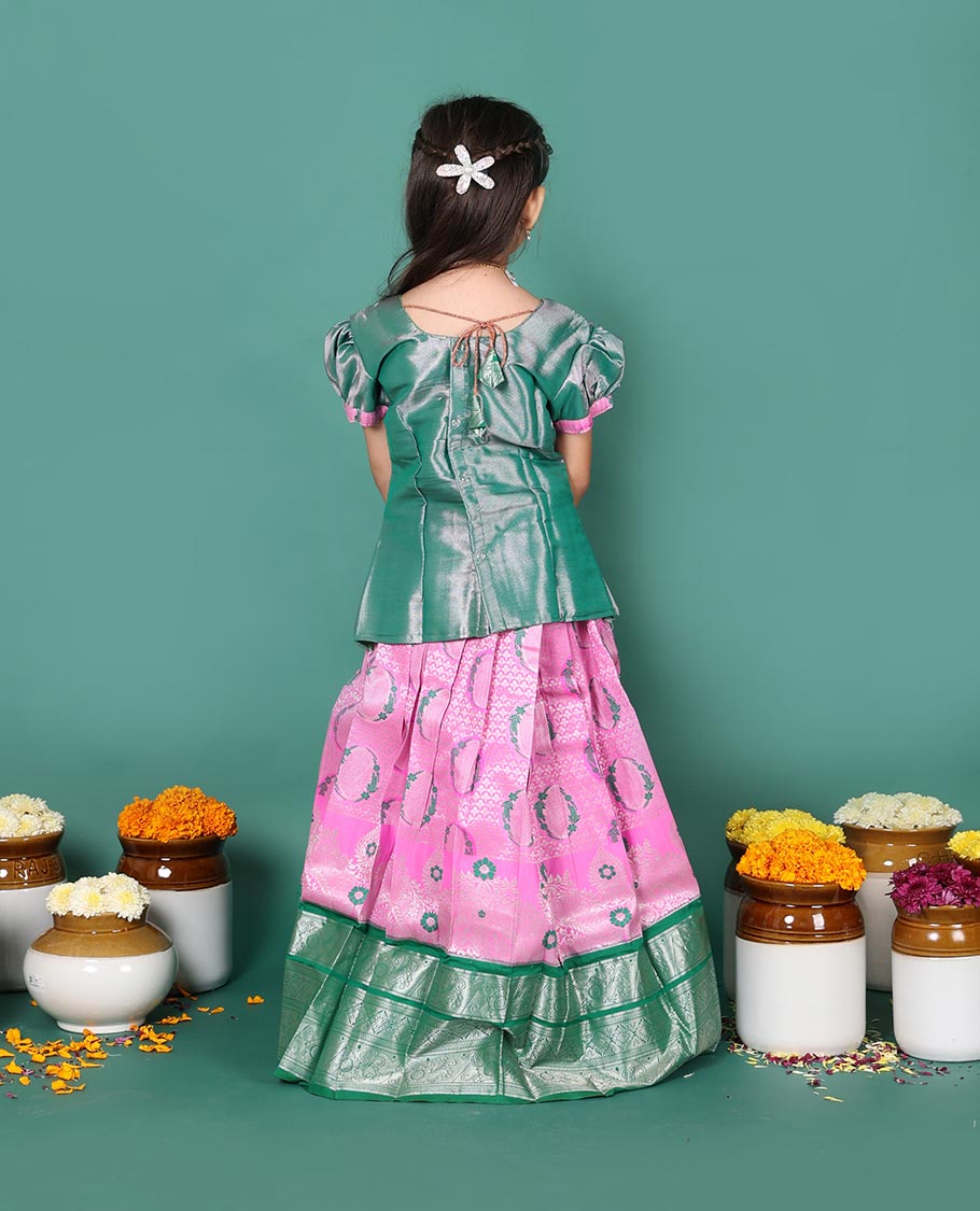 Pink art silk readymade pavadai set, jacquard with contrast traditional zari border skirt, and contrast round neck embroidered puff-sleeve blouse