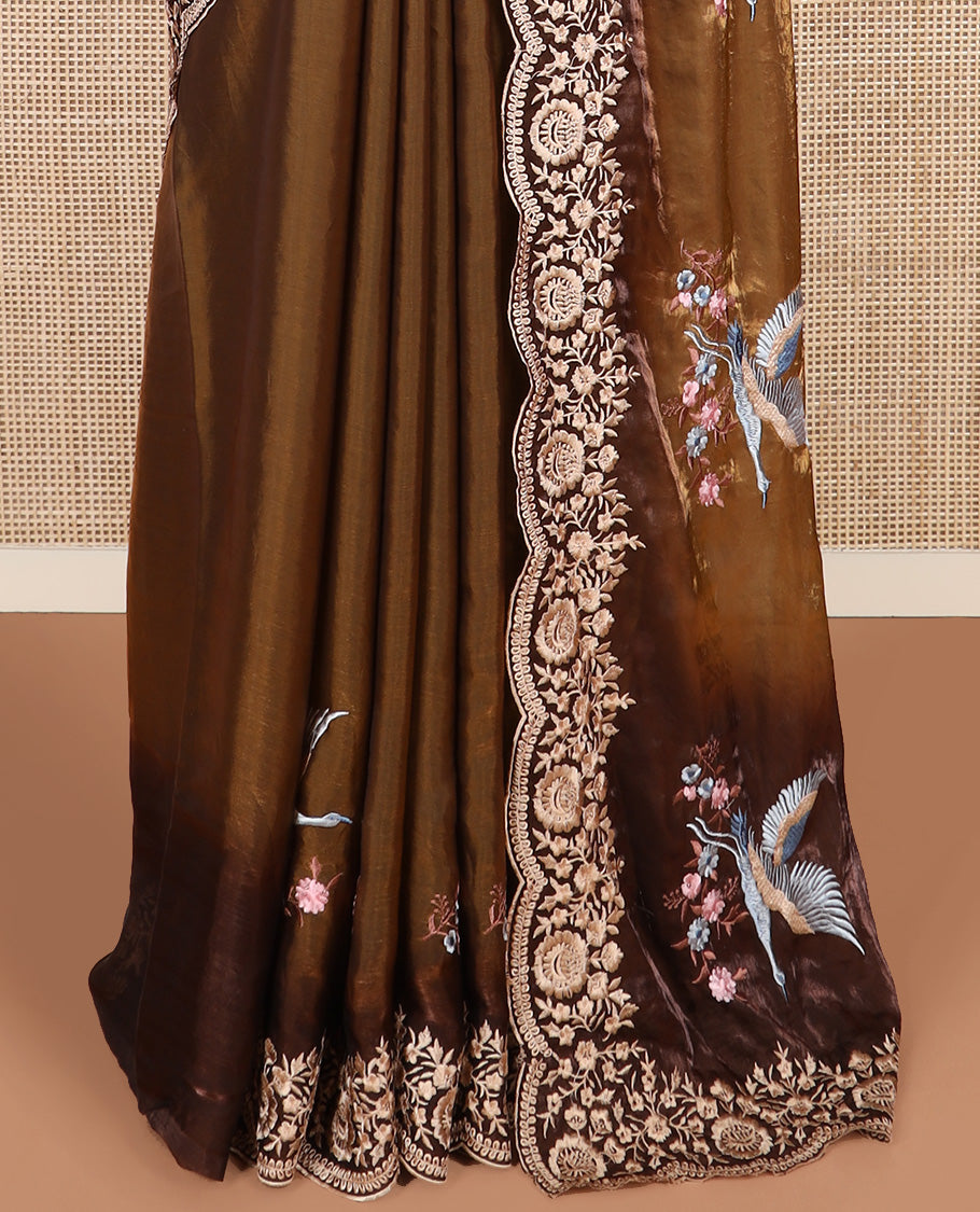 Brown crane and floral motifs thread embroidered designer saree, scallop floral thread embroidered border, and embroidered pallu