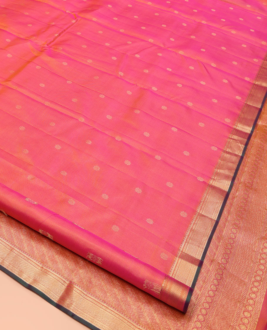 Pink Kanchipuram Silk Saree, Subtly Sparkled with Zari Buttas and Vazhaipoo Stripes All Over Its Body, Highlighted by a Zari Border of Rekku, Banaras, Neli, and Mayil Kann Designs, Intricately Designed Pallu, and Paired with a Matching Blouse