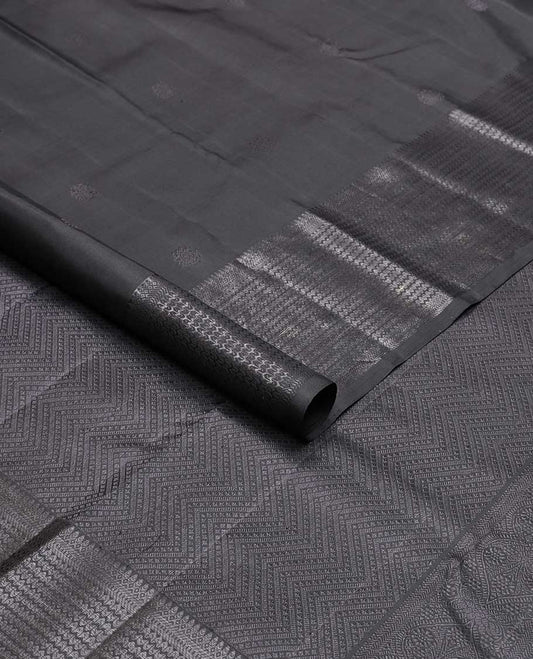 Black buttas kancheepuram silk saree with self border of thilakam mokku, muthu, banaras design & zari design pallu