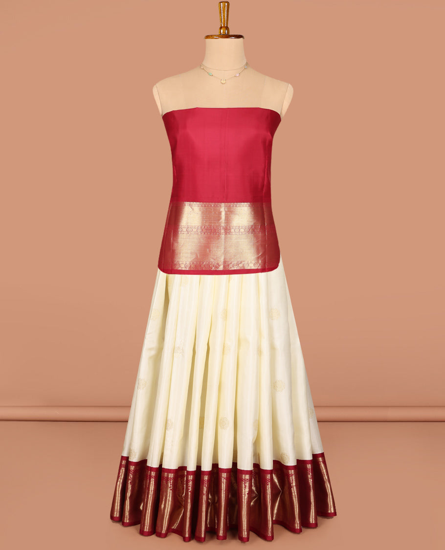 Cream Pure Silk Half-Saree, Enthralled with Zari Buttas All Over Its Skirt, Complemented by Contrast Wedding-Theme Border of Poo Chakram and Rudraksham Designs, Paired with a Contrast Blouse, and Comes with a Dhavani of Ogee Patterns