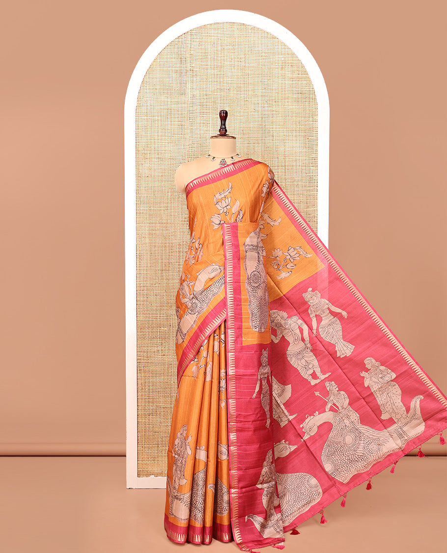 Orange Semi-Tussar Silk Saree, Artfully Detailed with Kalamkari-Style Human Motifs Printed on Its Body, Complemented by a Contrast Temple Zari Border, Creatively Kalamkari Printed Pallu, and Paired with a Contrast Blouse