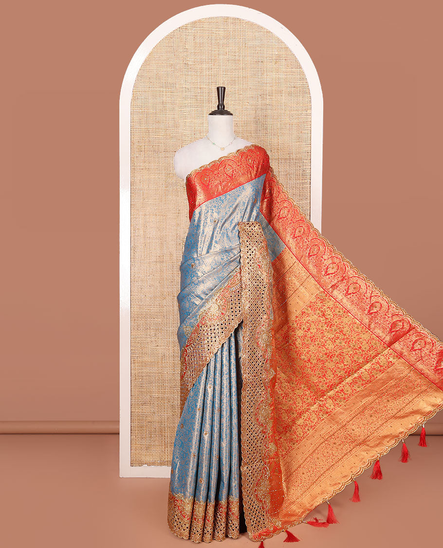 Blue Vastrakala Silk Saree, Adorned with Floral Jacquard and Stone Work, Complemented by Contrast Traditional Zari and Cut Embroidered Scallop Border, Gleaming Grand Zari-Stone Work Pallu, and Paired with Contrast Heavy Stone Embroidered Blouse