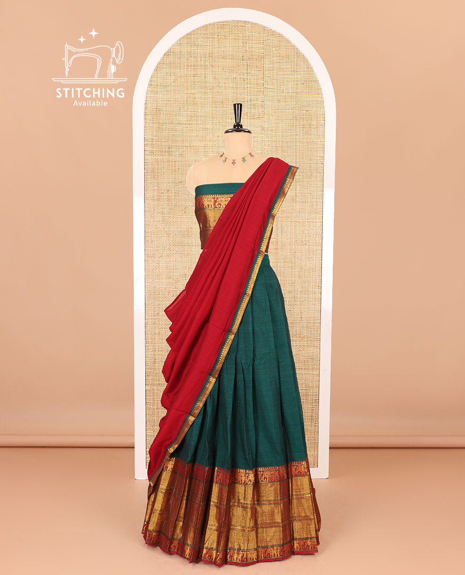 Dark green half-saree, plain with big contrast traditional zari motifs steeped border skirt, matching blouse and a plain zari border contrast dhavani