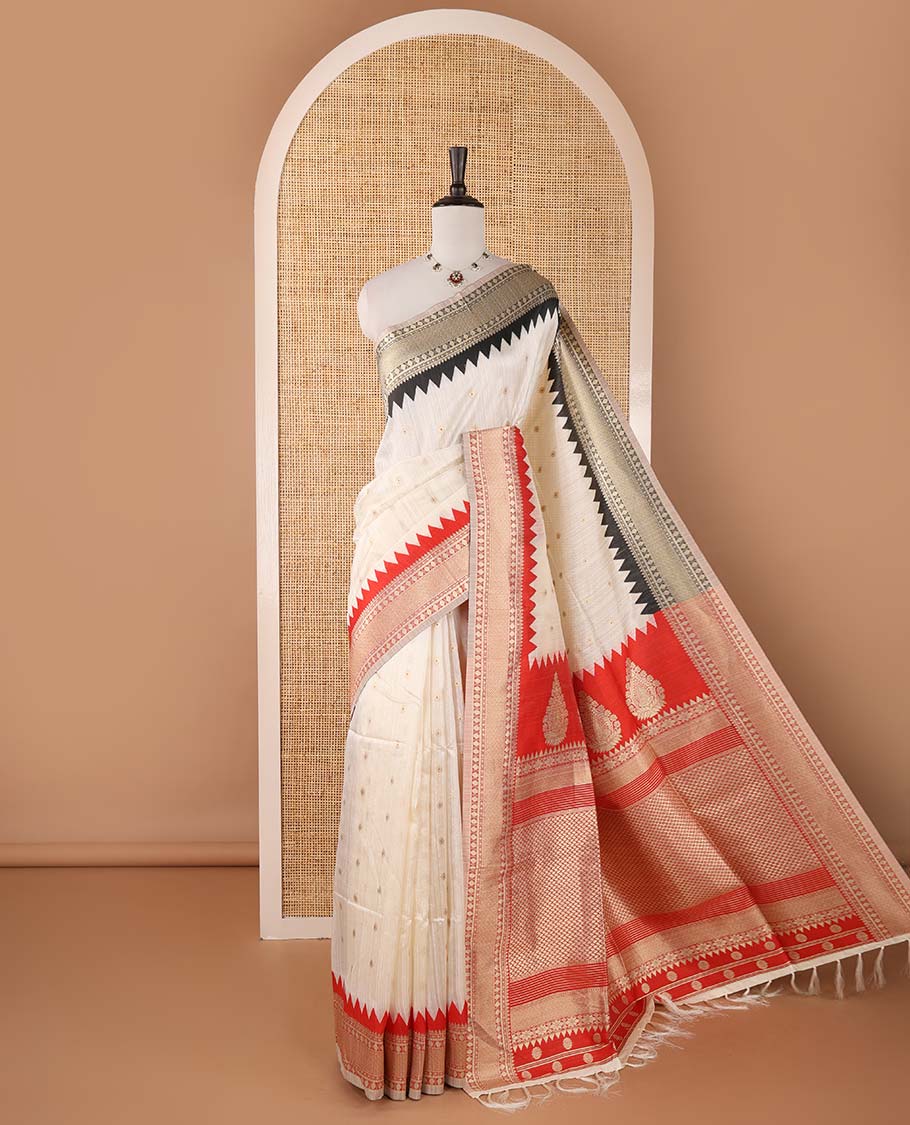 Half-white buttas banarasi jute saree, contrast traditional zari ganga-jamuna-style satin thread border, intricate pallu & plain blue blouse
