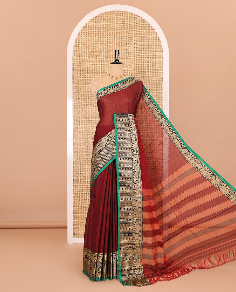 Maroon plain mercerised cotton saree, contrast traditional motifs thread woven border, striped pallu, and a matching blouse