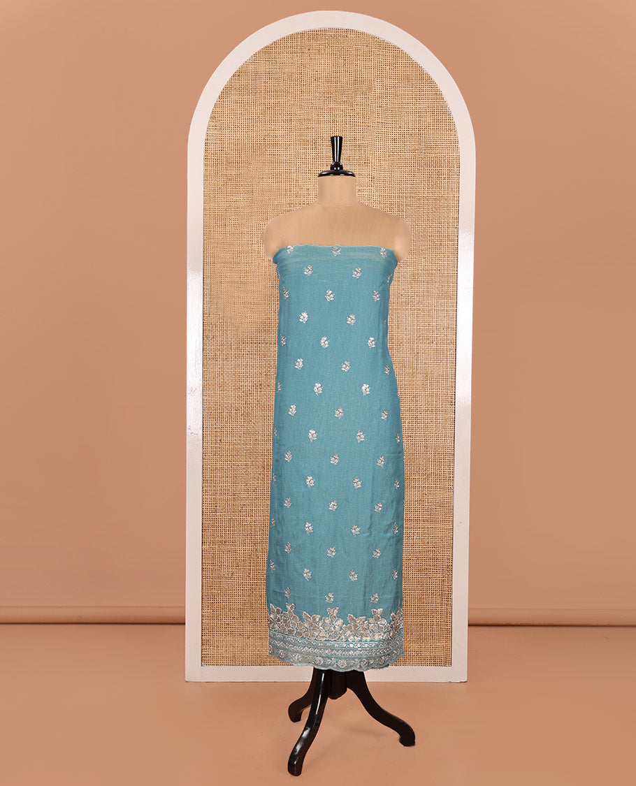Blue Material Churidar Set, Artfully Detailed with an Floral Motifs Embroidered on Its Nc Moss Organza Top, Plain Santoon Bottom, and Nc Moss Organza Scallop Dupatta of Floral-Leaf Embroidery