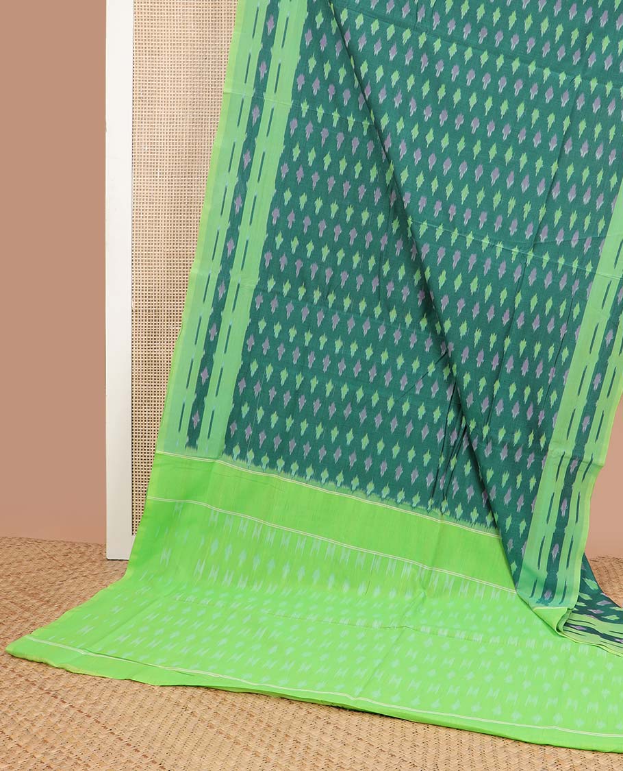 Dark green geometric design ikkat cotton saree with contrast floral border & geometric design pallu