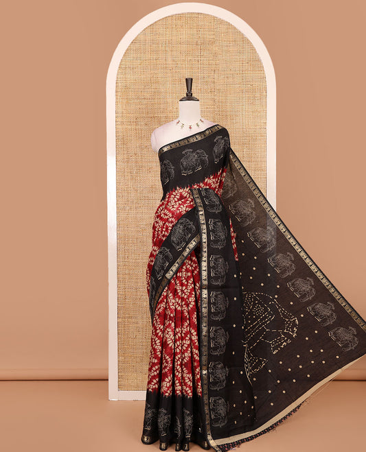 Maroon diamond patterns Shibori-style printed muslin cotton saree, contrast elephant motifs printed border, batik elephant motifs pallu & contrast flower buttas printed blouse