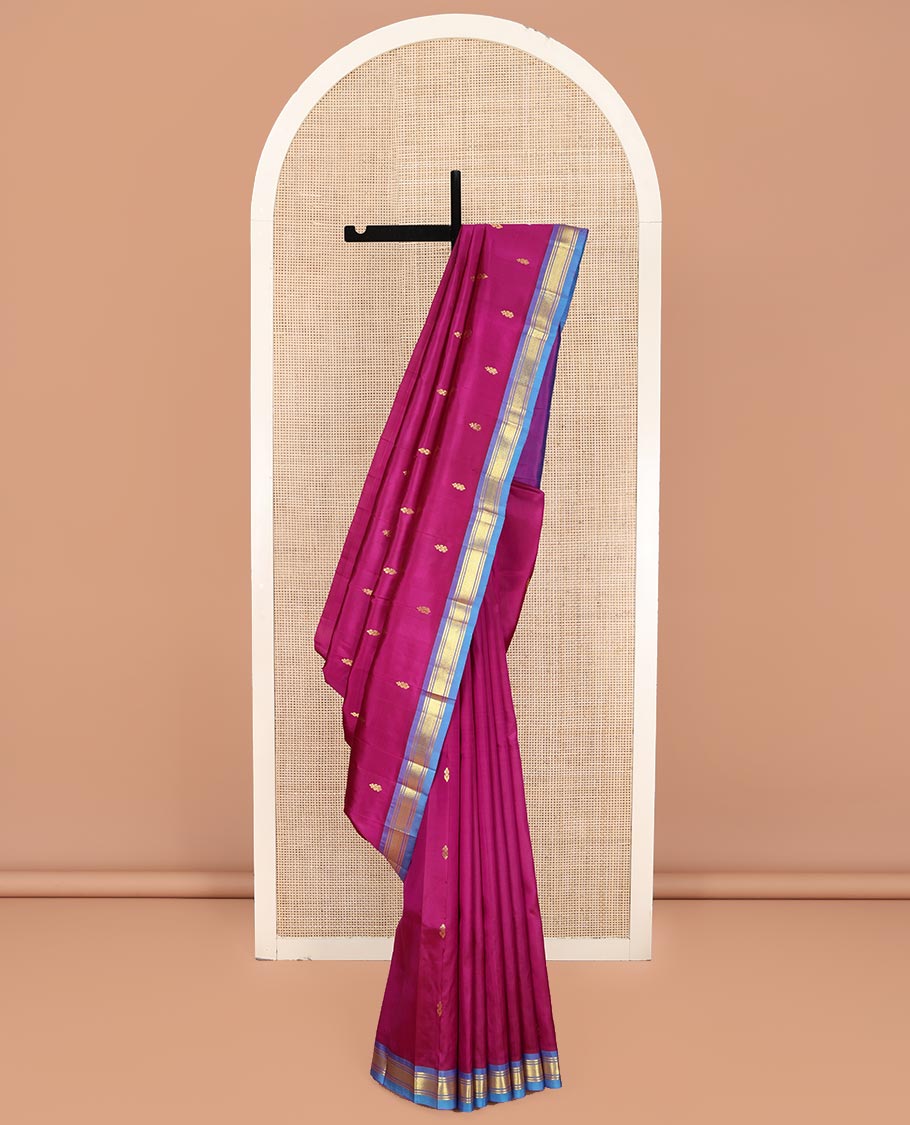 Magenta Kanchipuram Silk Saree, Adorned with Zari Buttas on Its Body, Complemented by a Contrast One-Sided Border of Banaras and Jaal Designs, Pallu Features Zari Designs, and Comes Without a Blouse