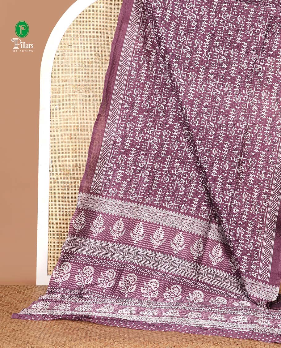 Lavender batik-style warli printed Litch crushed saree, batik chevron border, floral-geometric printed pallu & triangle motif blouse
