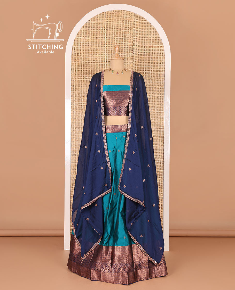 Rama green taffeta silk half-saree, flower zari buttas and contrast traditional zari bordered skirt, a matching blouse, and contrast embroidered satin georgette scallop dhavani