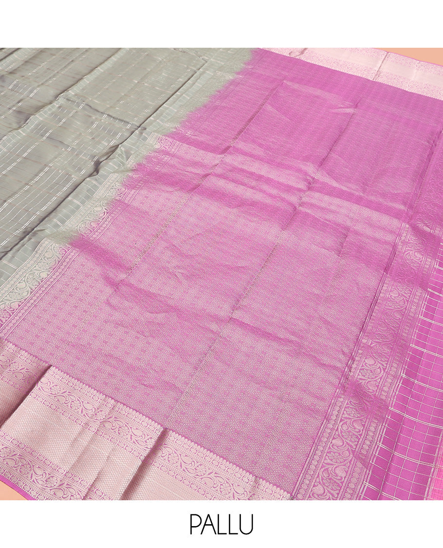 Grey Vasundhara Lite Silk Mix Saree, Gracefully Embellished with Zari Checks On Its Body, Complemented by Contrast Border of Thilakam, Poun, Muthu, Kodi Visiry, and Mayil Kann Designs, Grand Pallu and Paired with a Contrast Blouse