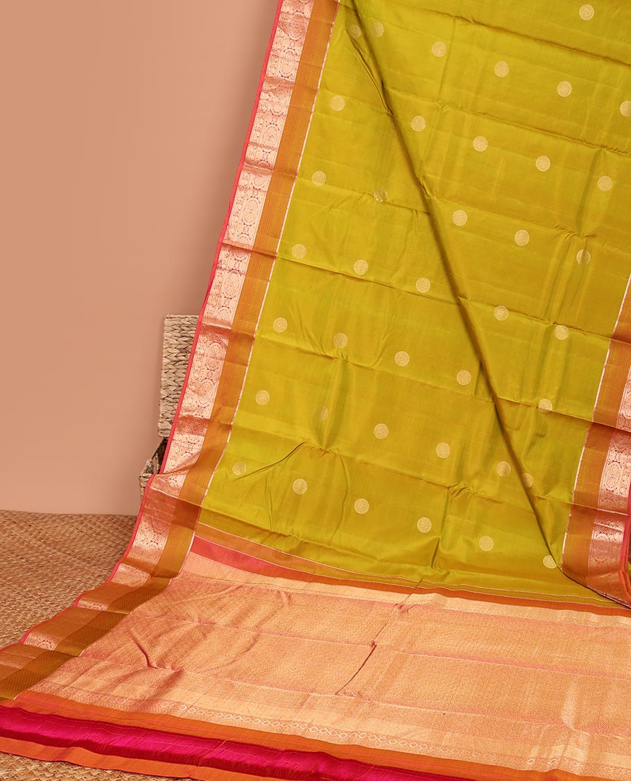 Green chakram buttas silk saree, contrast border of chakram,mayil & mayil kann & intricate pallu