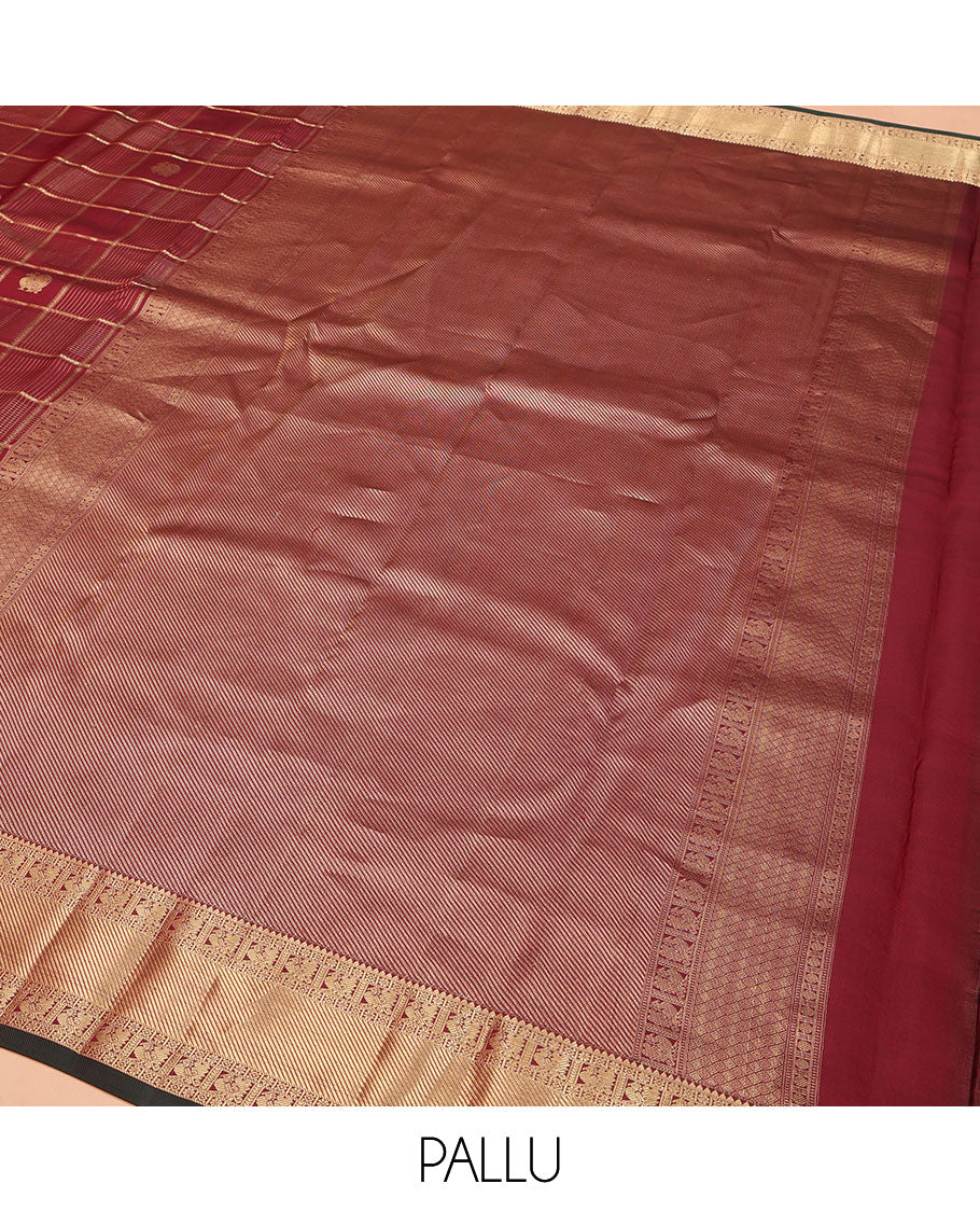 Maroon Vasundhara Silk Saree, Embellished with Zari Buttas and Zari Checks All Over Its Body, Highlighted by a Zari Border of Rekku, Kamalam, Diamond, and Mayil Designs, Diagonally Zari Striped Pallu, and Paired with a Contrast Blouse