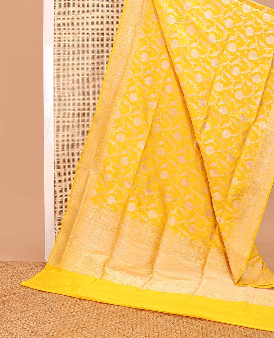 Yellow floral jacquard banaras silk saree with self intricate zari border & floral zari design pallu