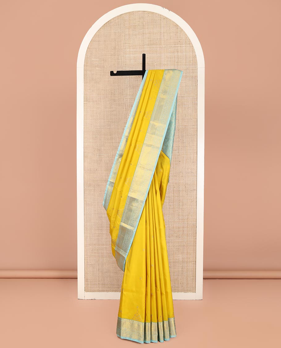 Yellow Budget Silk Saree, Sparsely Woven with Zari Buttas on Its Body, Complemented by Contrast Traditional Zari Border of Floral Creeper Designs, Intricately Designed Pallu, and Paired with a Contrast Blouse