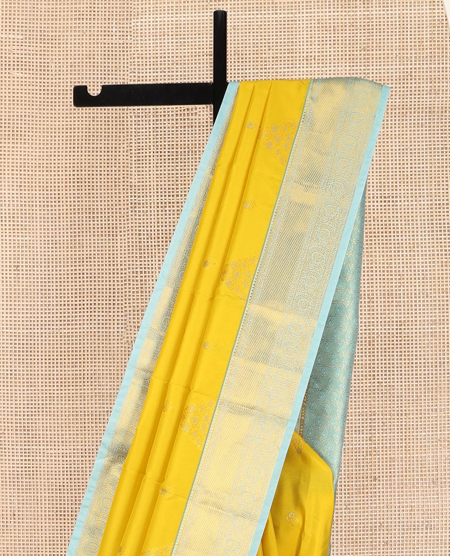 Yellow Budget Silk Saree, Sparsely Woven with Zari Buttas on Its Body, Complemented by Contrast Traditional Zari Border of Floral Creeper Designs, Intricately Designed Pallu, and Paired with a Contrast Blouse