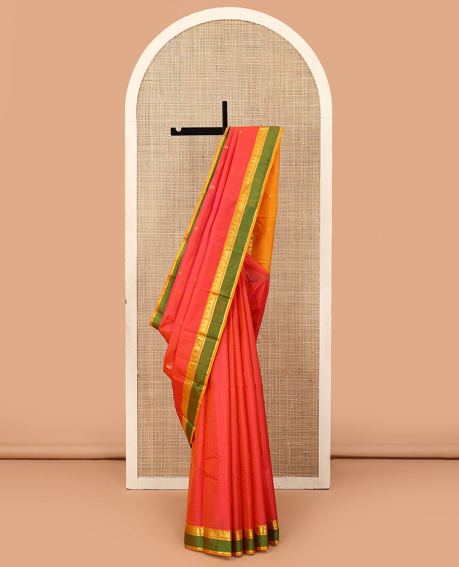 Orange striped and buttas Kanchipuram silk saree, contrast rettai pettu border of paneer sombu, vanki, and kathir designs, and zari design pallu