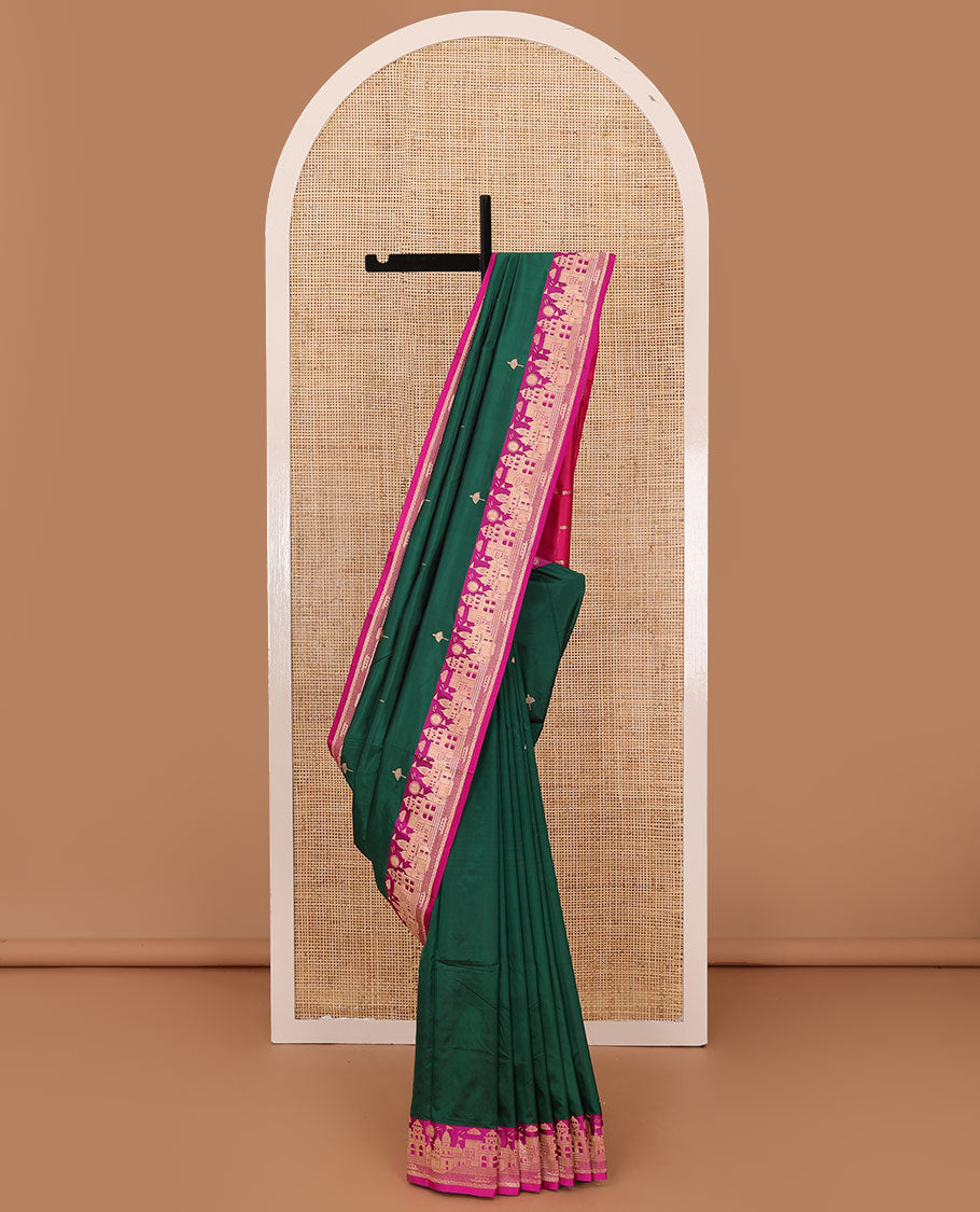 Dark green zari buttas katan silk saree, contrast Mughal style buildings featured border, and pallu mirroring the same border design