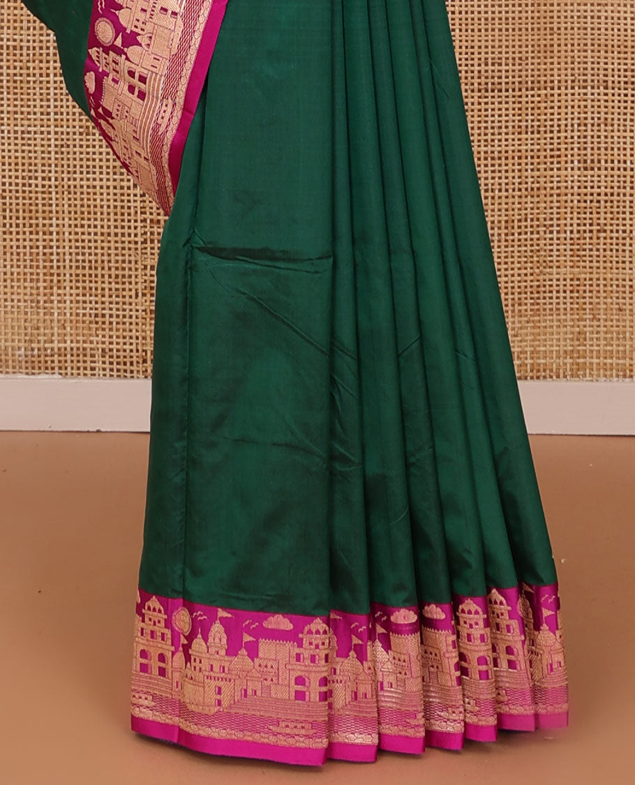 Dark green zari buttas katan silk saree, contrast Mughal style buildings featured border, and pallu mirroring the same border design