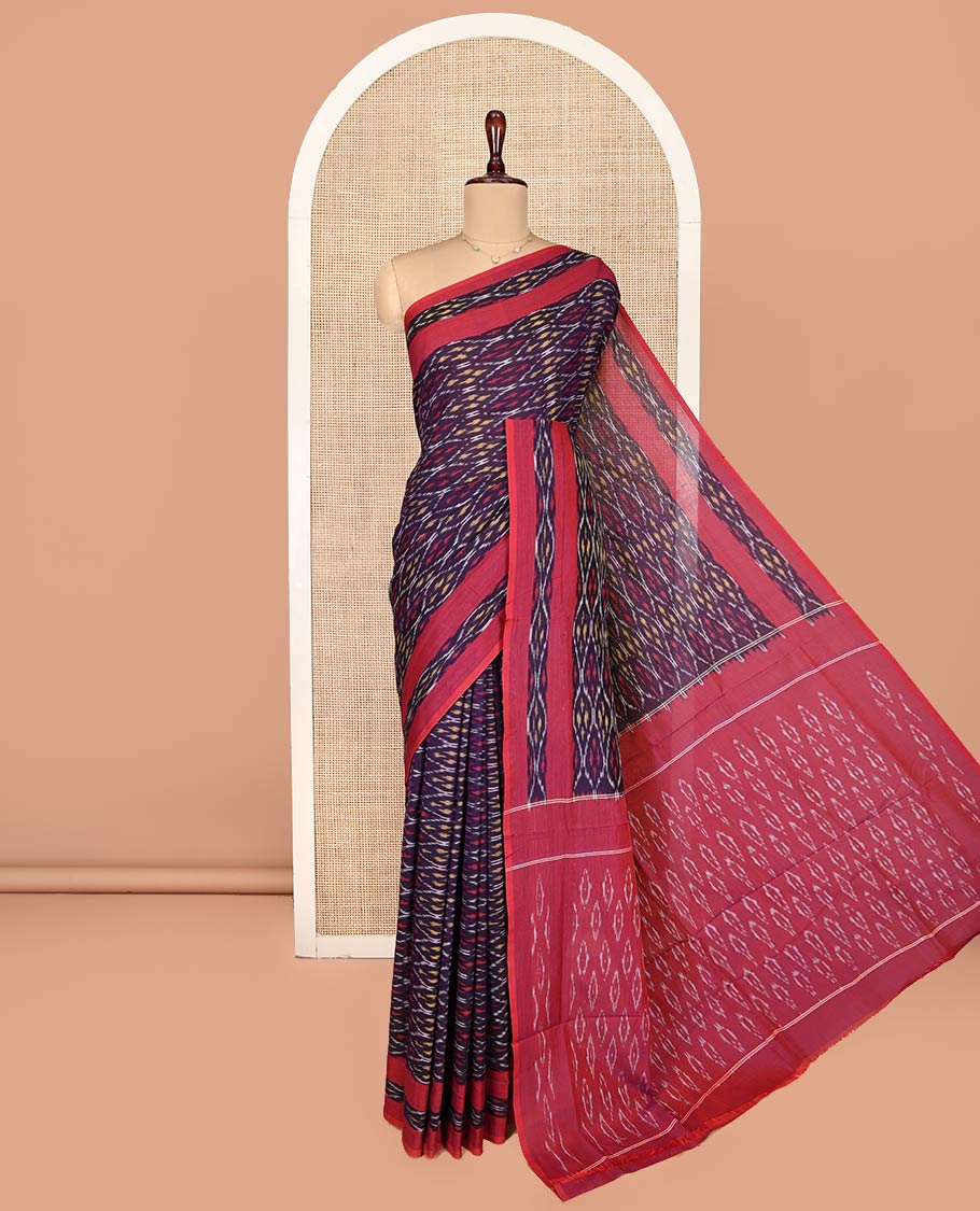 Blue Ikkat Cotton Saree, Enthralled with Ikkat-Style Ogee Patterns on Its Body, Complemented by a Contrast Ikkat Textured Border, Pallu Steeped with Ikkat-Style Buttas, and Has No Blouse