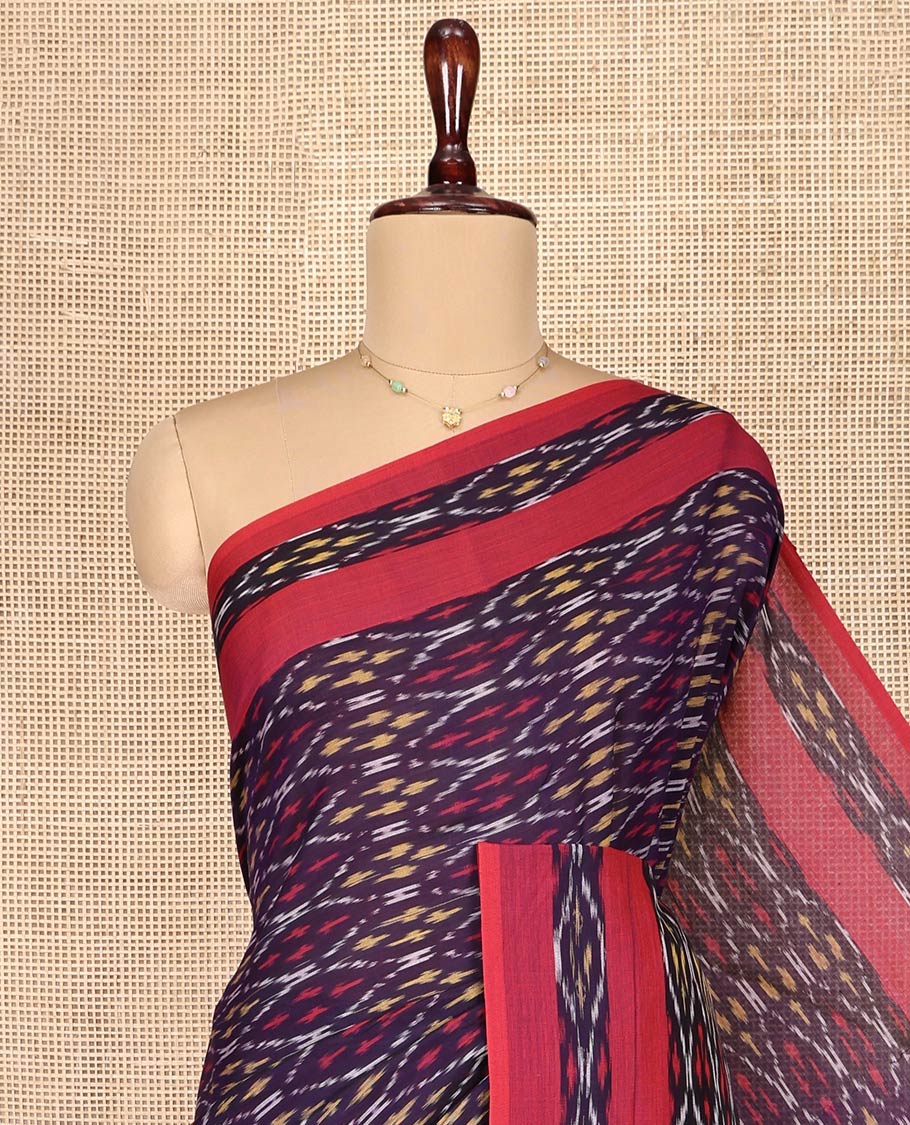 Blue Ikkat Cotton Saree, Enthralled with Ikkat-Style Ogee Patterns on Its Body, Complemented by a Contrast Ikkat Textured Border, Pallu Steeped with Ikkat-Style Buttas, and Has No Blouse
