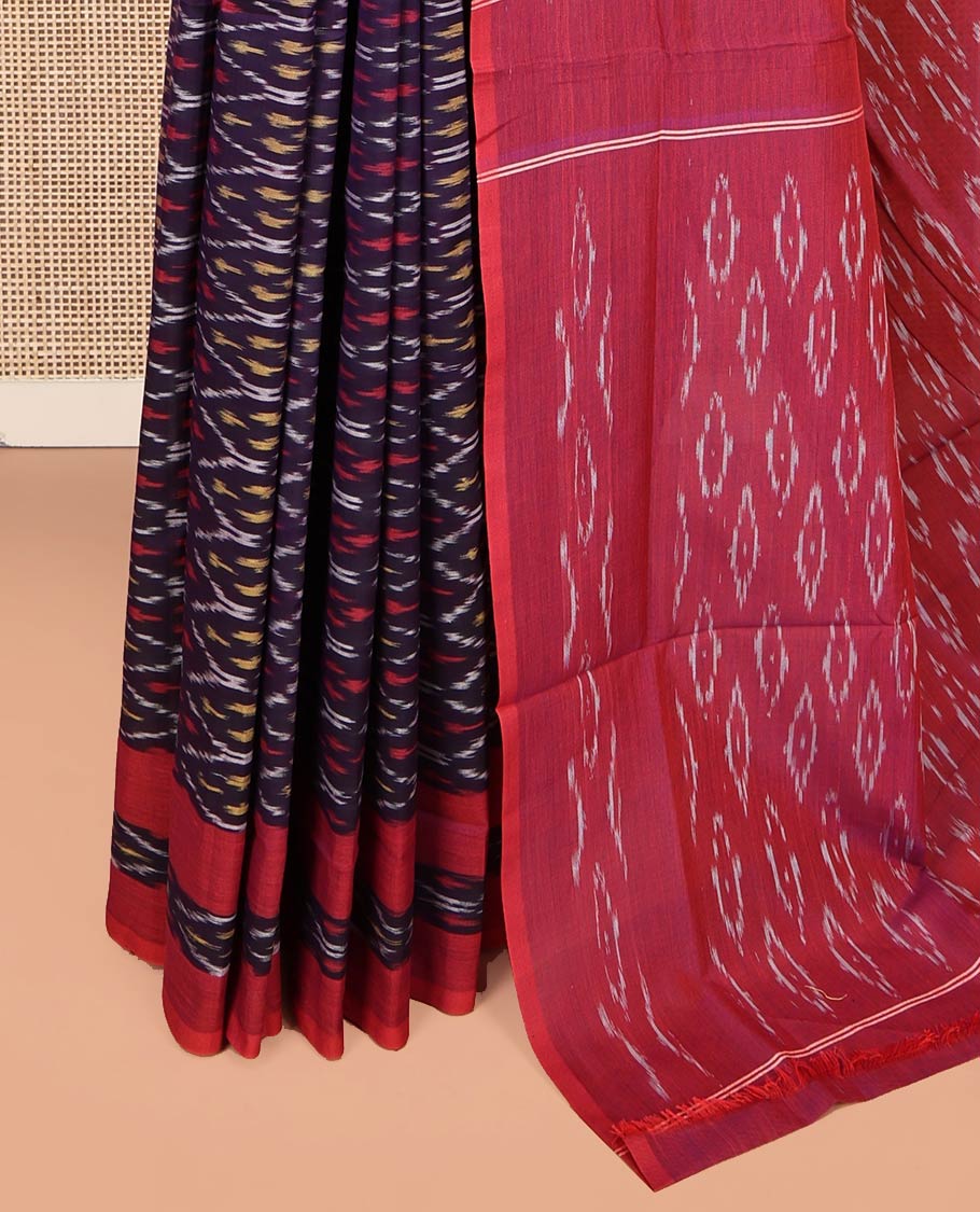 Blue Ikkat Cotton Saree, Enthralled with Ikkat-Style Ogee Patterns on Its Body, Complemented by a Contrast Ikkat Textured Border, Pallu Steeped with Ikkat-Style Buttas, and Has No Blouse