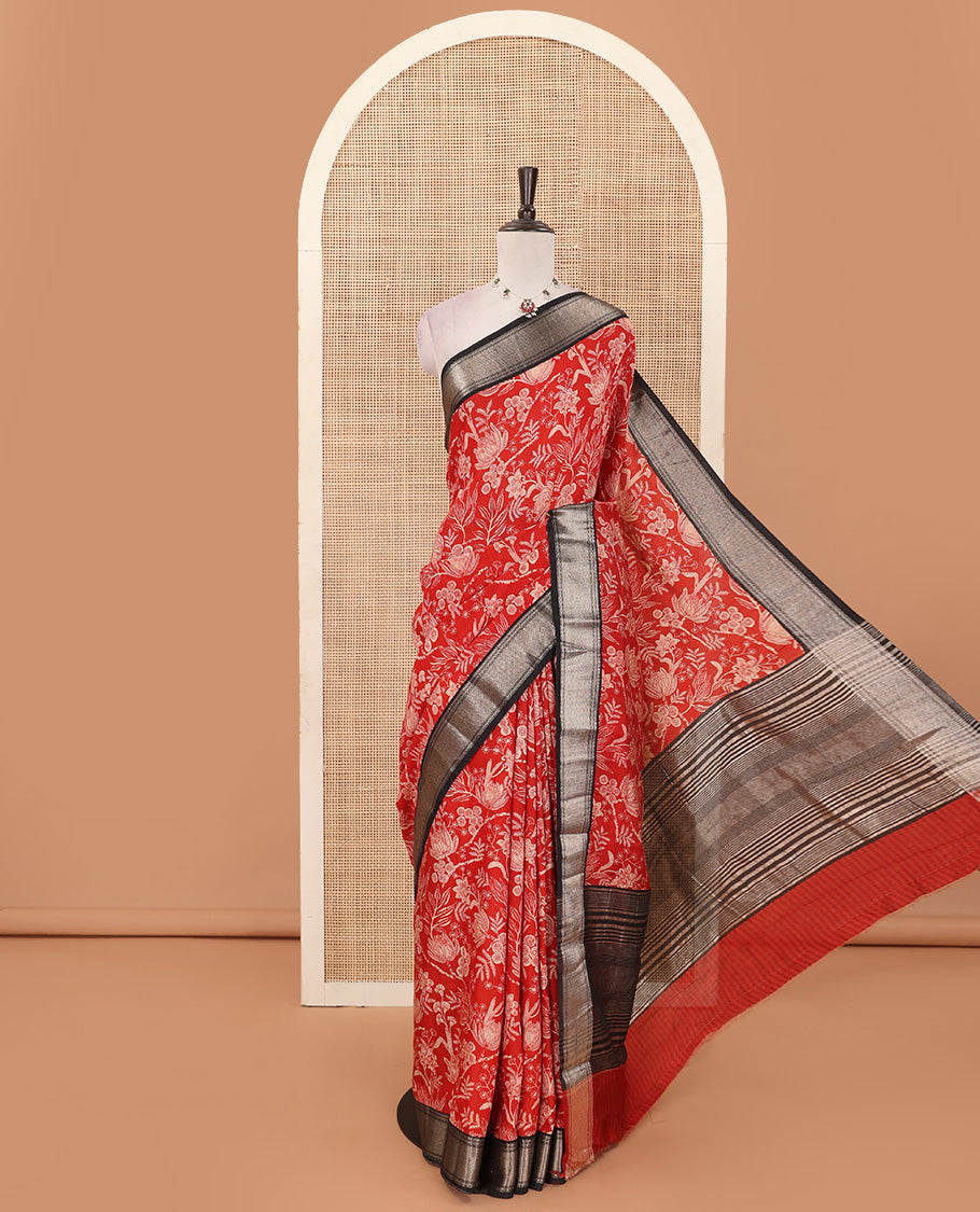 Red floral printed muga silk saree, contrast zari traditional temple border, and gleaming zari striped pallu
