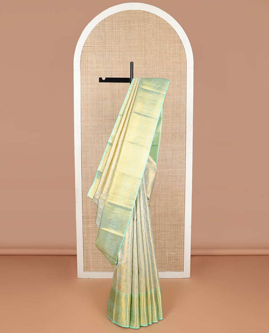 Mint green floral design kancheepuram tissue silk saree with contrast border of intricate zari design border & argyle design pallu