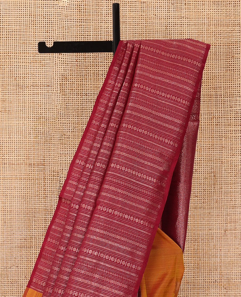 Borderless orange manga zari buttas Kanchipuram silk saree, contrast geometric patterned pallu