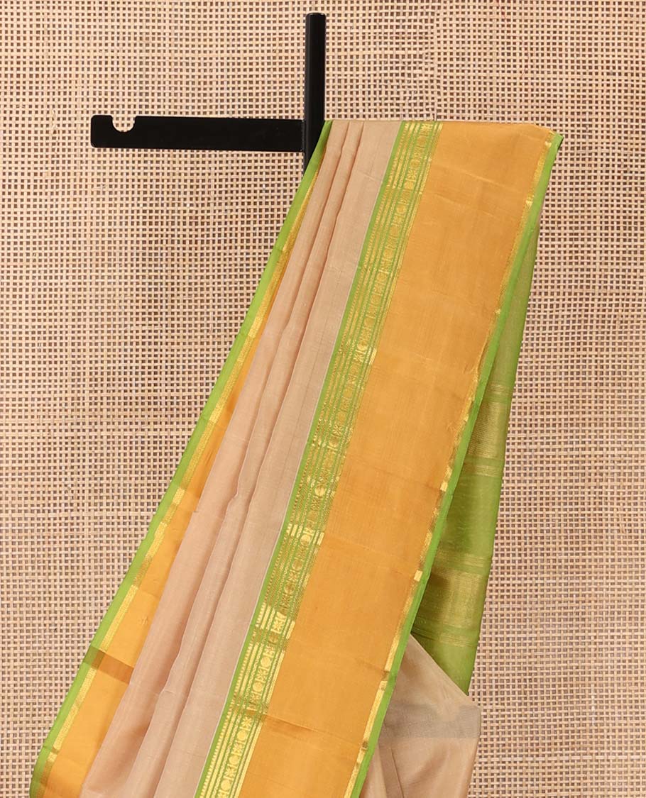 Sandal plain Kanchipuram silk saree, contrast rettai pettu border of rekku, banaras, cross kamalam, and poun designs, and zari design pallu