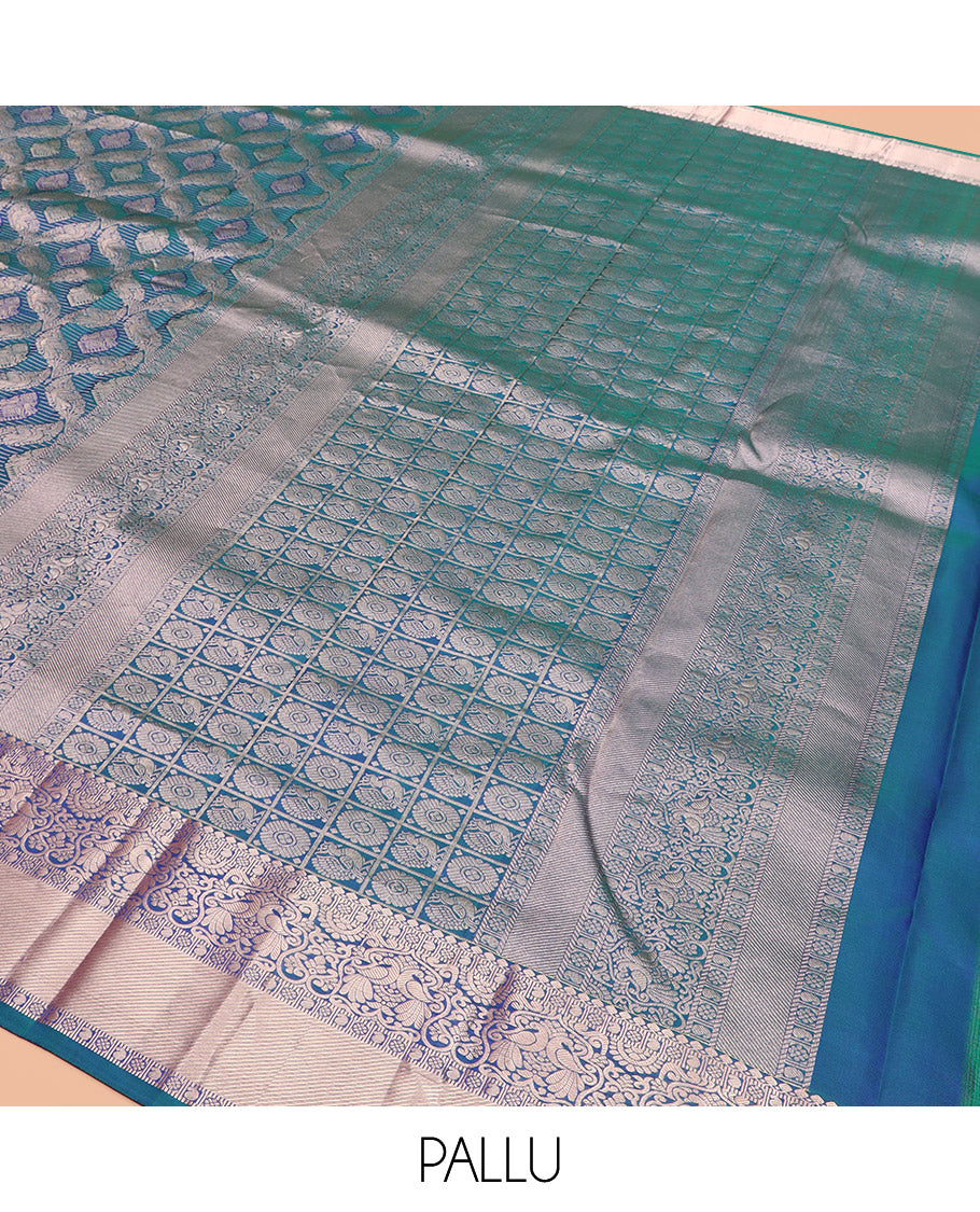 Blue Kanchipuram Wedding Silk Saree Graced with Ogee Jacquard Design, Complemented by Zari Border Featuring Thilakam Mokku, Kamalam, Manga, and Mayil Designs, Opulently Detailed Pallu of Annam Charkam Enclosed Checks, and Paired with a Matching Blouse