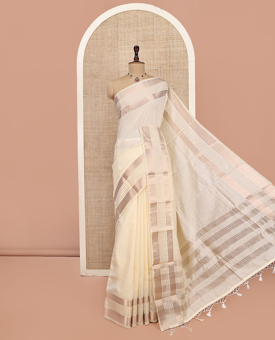 Cream Plain Assam Silk Saree, Highlighted by a Traditional Zari Border, Zari-Striped Pallu, and a Matching Blouse