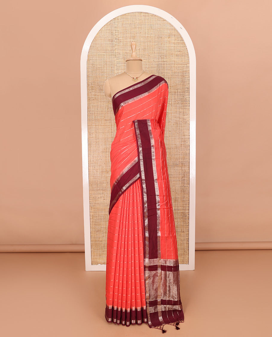 Peach Assam Silk Saree Embellished with Zari Stripes, Complemented with a Contrast Traditional Design Border, Zari-Elevated Pallu, and Paired with a Contrast Blouse