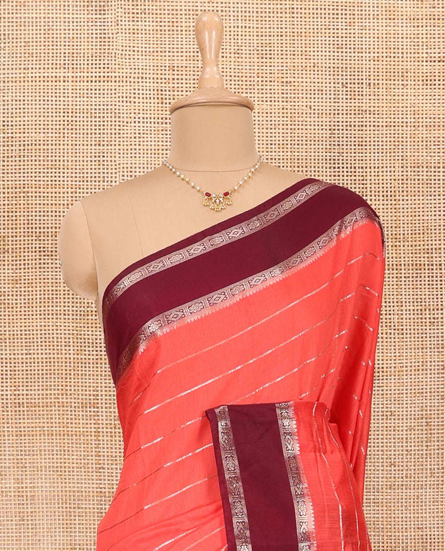 Peach Assam Silk Saree Embellished with Zari Stripes, Complemented with a Contrast Traditional Design Border, Zari-Elevated Pallu, and Paired with a Contrast Blouse