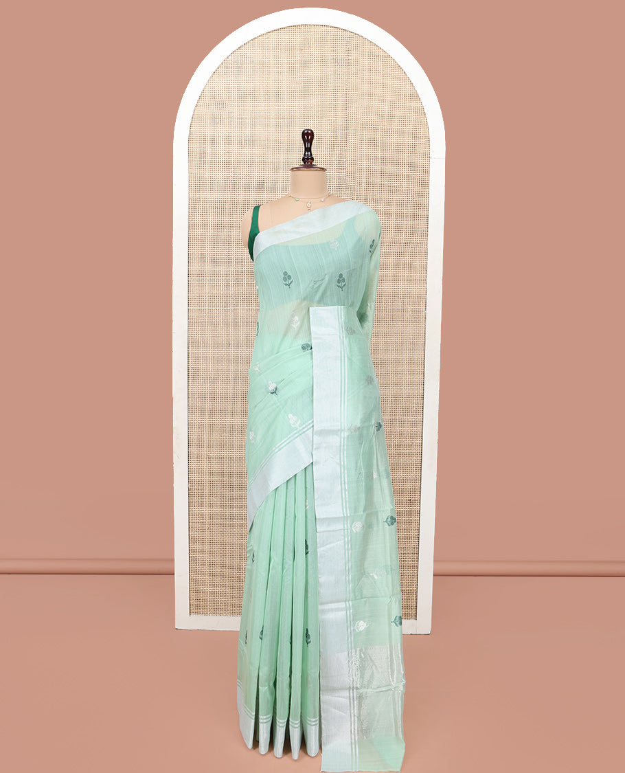 Green Chanderi Cotton Saree, Subtly Decked up with Floral Buttas All Over Its Body, Highlighted by a Bavanji Border, Pallu Steeped with Zari Stripes, and Paired with a Matching Blouse
