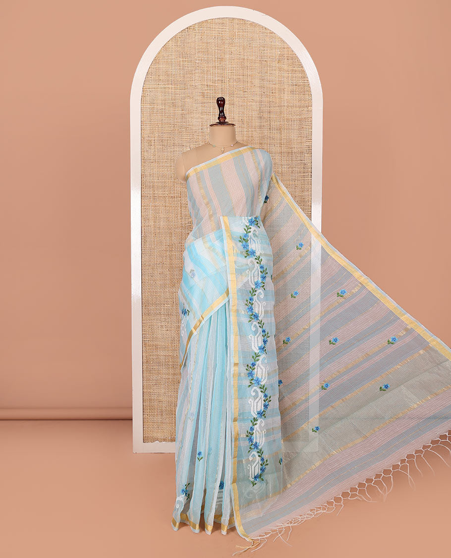 White and Blue Kota Cotton Saree, Adorned with Stripes and Floral Motifs Thread Embroidery on Its Body, Piping Border, Pallu Features Floral Embroidery, and Paired with a Matching Blouse