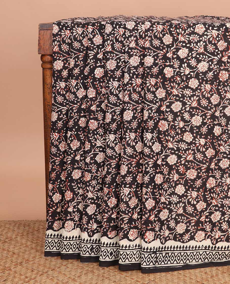 Black floral vine machine-printed Kalamkari cotton saree, geometric printed border, and geometric printed pallu