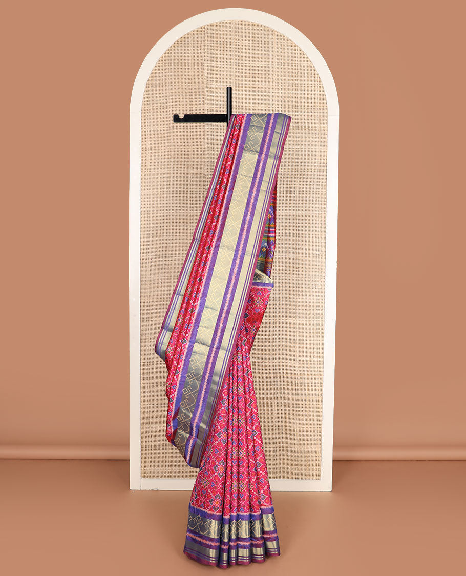 Pink intricately designed patola silk saree, contrast ikkat border, and pallu of stripes