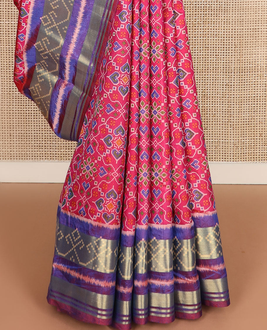 Pink intricately designed patola silk saree, contrast ikkat border, and pallu of stripes
