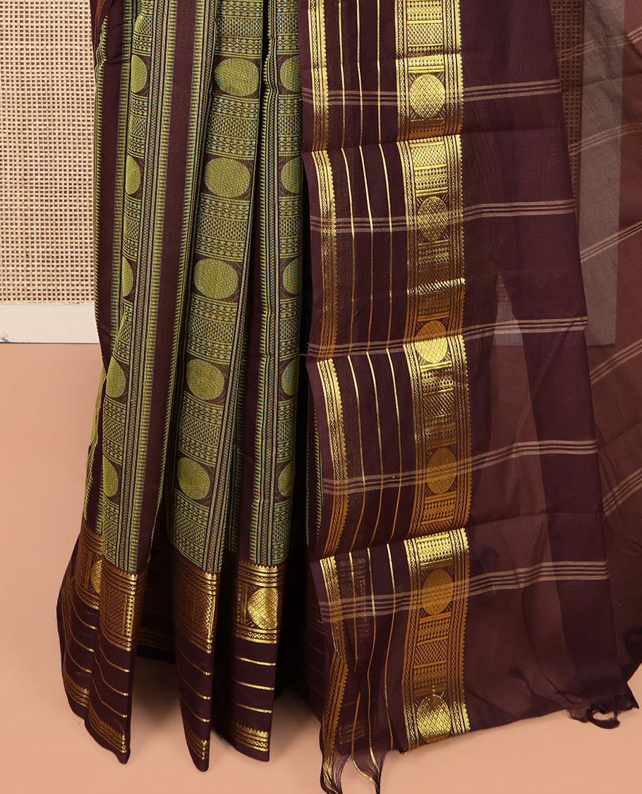 Brown Coimbatore Cotton Saree, Steeped in the Richness of Geometric Design on Its Body, Highlighted by Traditional Zari Border, Striped Pallu, and Paired with a Matching Blouse