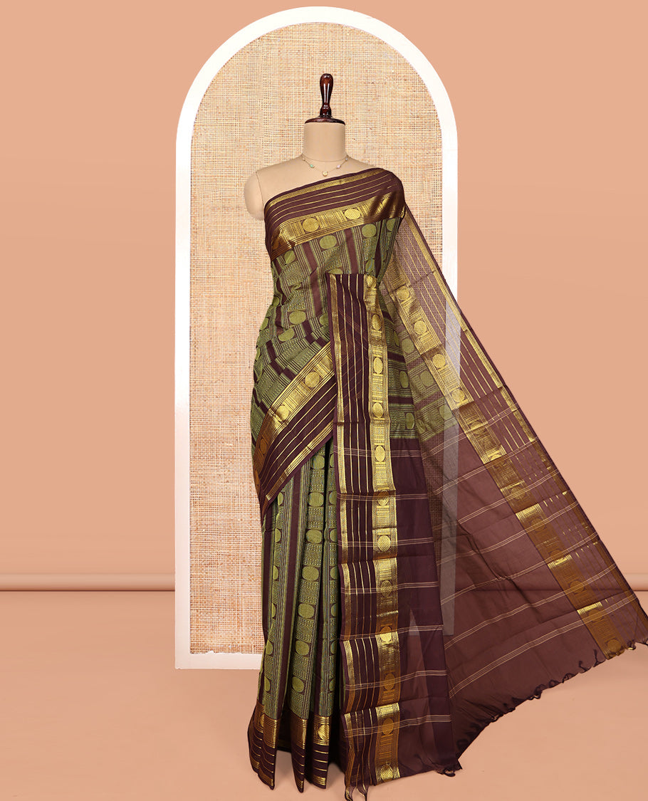 Brown Coimbatore Cotton Saree, Steeped in the Richness of Geometric Design on Its Body, Highlighted by Traditional Zari Border, Striped Pallu, and Paired with a Matching Blouse
